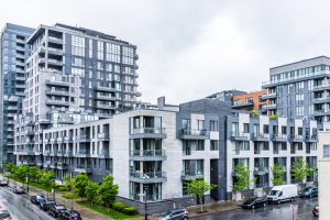 Montreal: Modern new apartment condos in city in Quebec region during rainy cloudy wet day